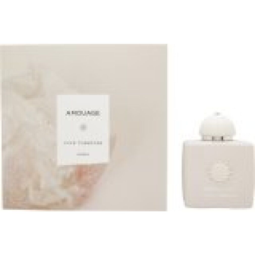 Flacone beige con tappo bianco e confezione. Scritta "AMOUAGE LOVE TUBEROSE". Confezione con motivo floreale.