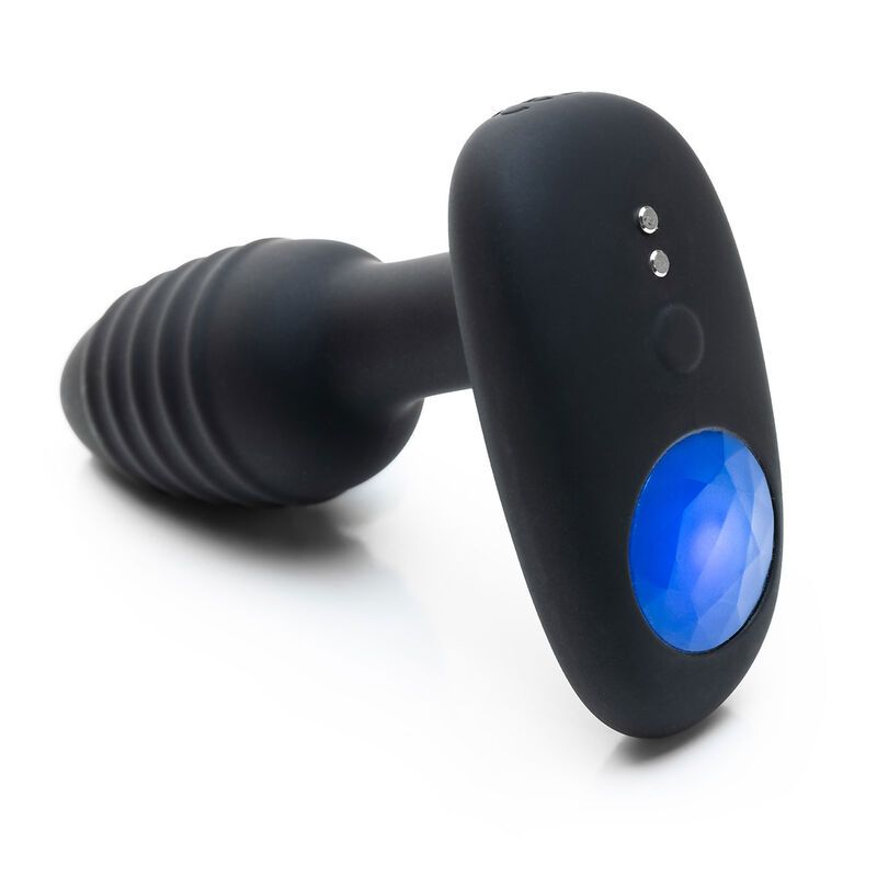 Prodotto benessere nero con estremità scanalata e pannello ovale con luce blu. Due pulsanti.
