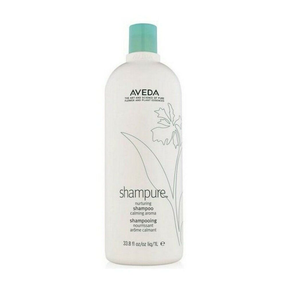 Flacone di shampoo bianco con tappo blu. Scritte: Aveda, Shampure, shampoo nutriente. Decorazione floreale.