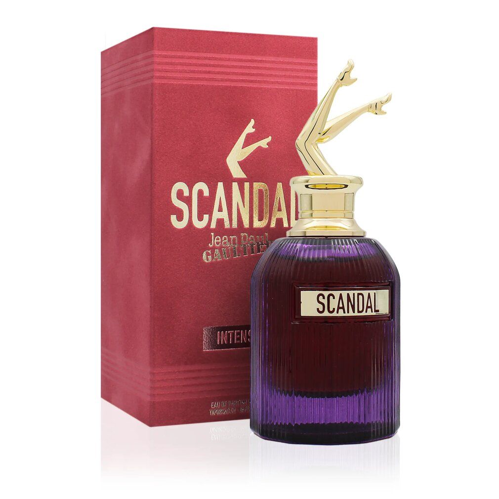 Confezione rosso-oro con flacone. Flacone con gambe dorate come tappo. Scritta "SCANDAL" e nome del marchio.