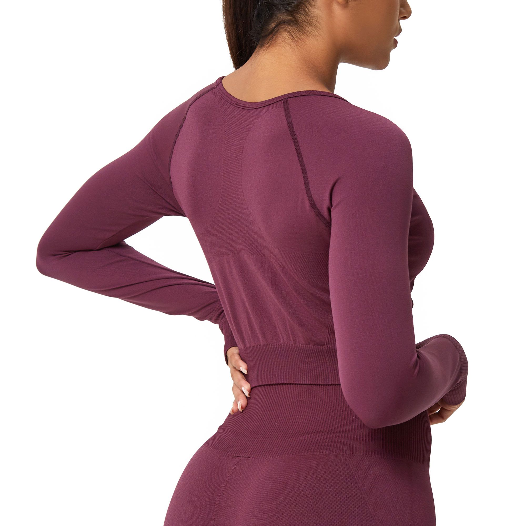 Top sportivo a maniche lunghe bordeaux con fascia elastica in vita e maniche raglan.