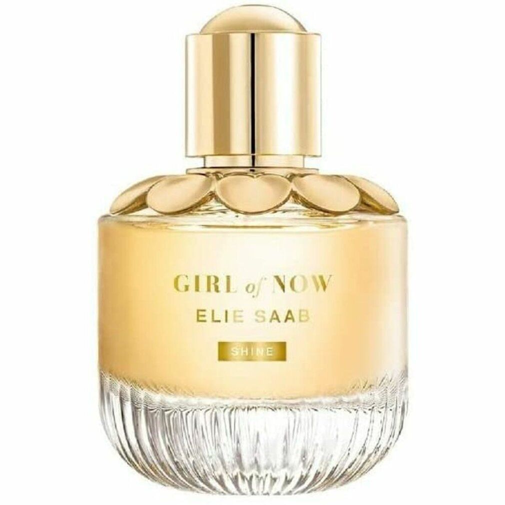 Flacone Girl of Now Shine Eau de Parfum dorato. Tappo dorato, colletto a forma di fiori. Flacone in vetro trasparente.