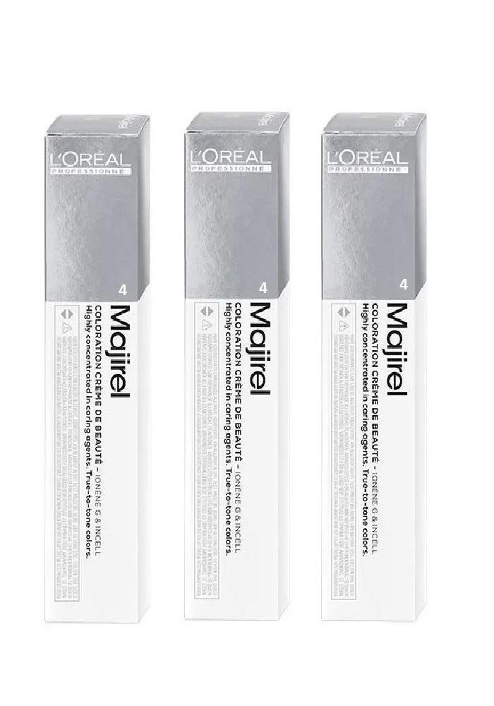 Tre confezioni di colorazione per capelli L'Oréal Majirel. Scritta: Coloration Crème de Beauté. Numero 4. Confezione argento e bianca.