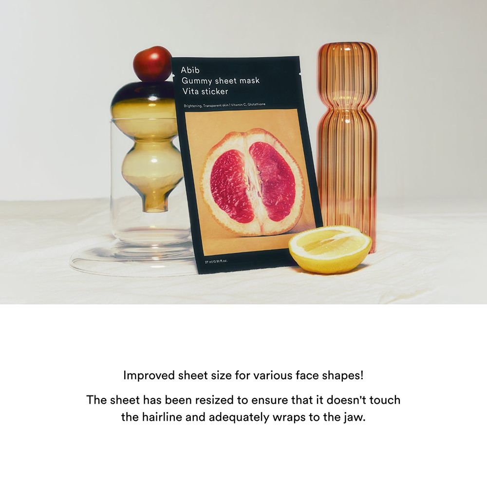 Confezione del prodotto con immagine di pompelmo e nome del prodotto. Accanto, un bicchiere, un limone e un pomodoro.