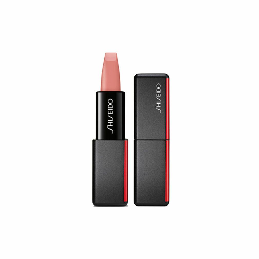 Rossetto con custodia nera e accento rosso. Il rossetto è rosa chiaro. Sulla custodia è scritto "SHISEIDO". Il coperchio è accanto.
