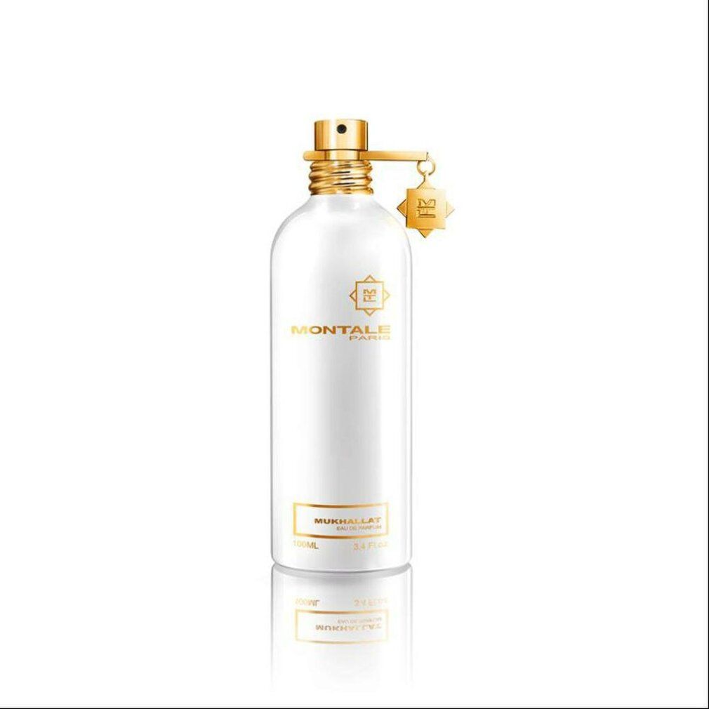 Flacone di profumo bianco con dettagli dorati. Scritta: Montale Paris, Mukhallat Eau de Parfum.
