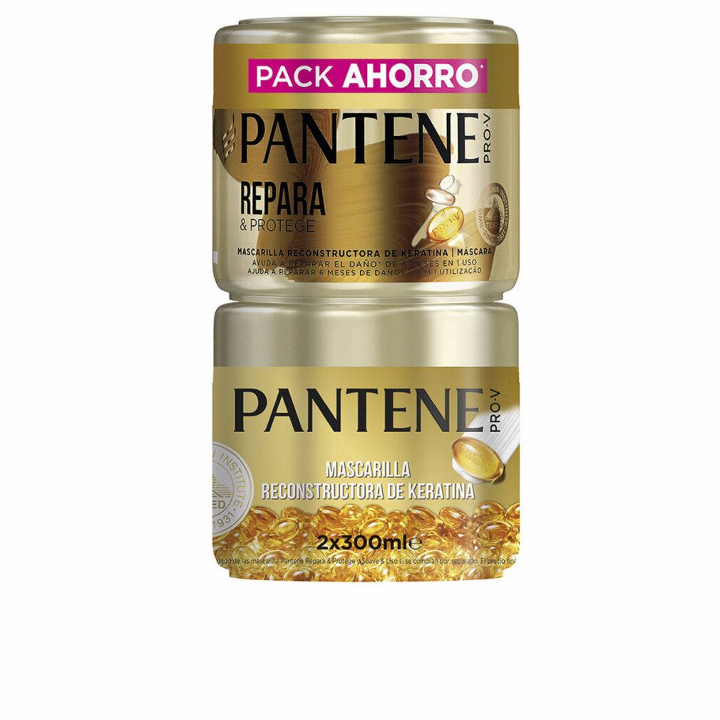 Due barattoli dorati impilati. Scritta: PANTENE PRO-V, RIPARA & PROTEGGE, MASCHERA. Barattolo inferiore: MASCHERA RECONSTRUCTORA DE KERATINA.