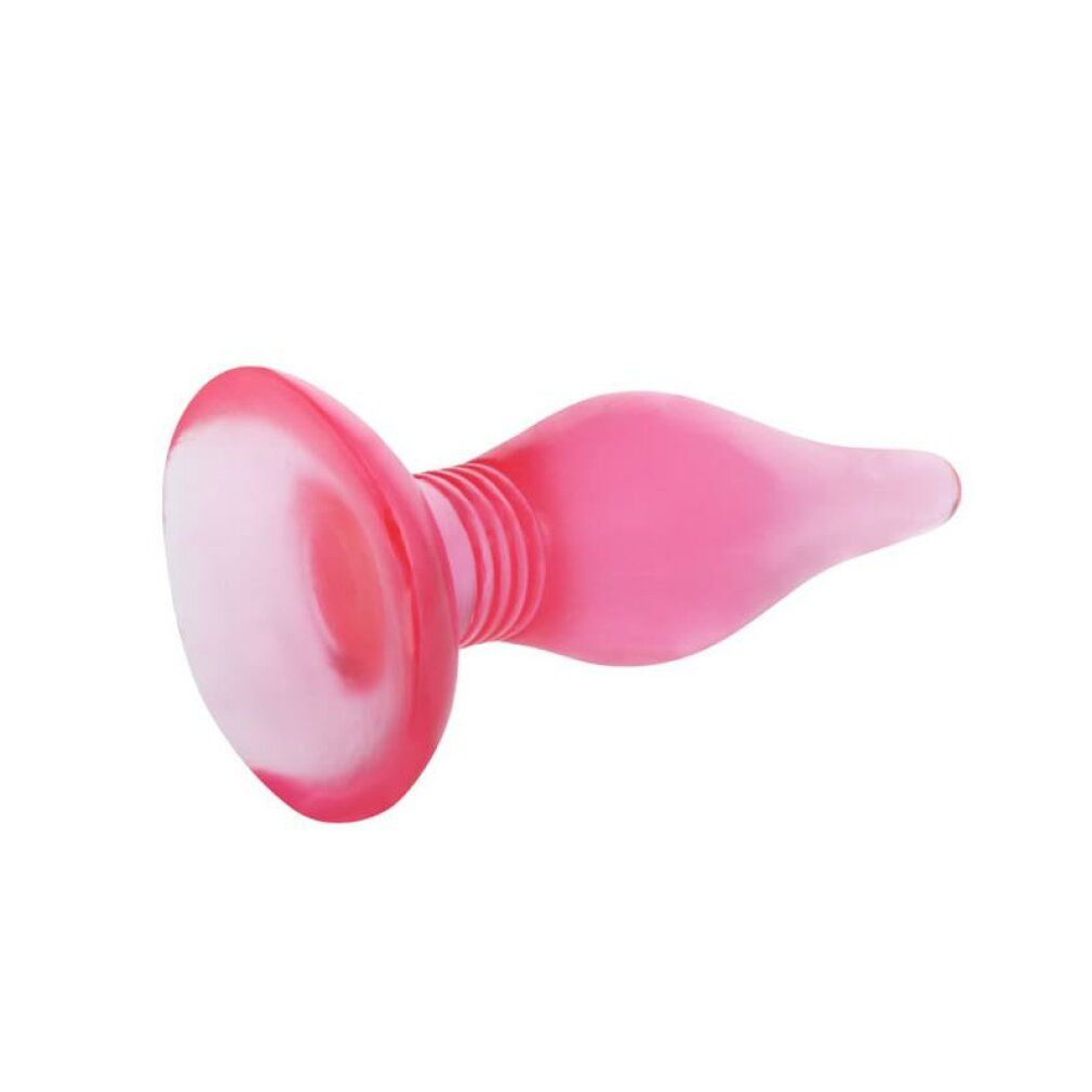 Plug anale rosa, sdraiato. Ampia base rotonda, raccordo scanalato allo stelo conico. Superficie liscia.