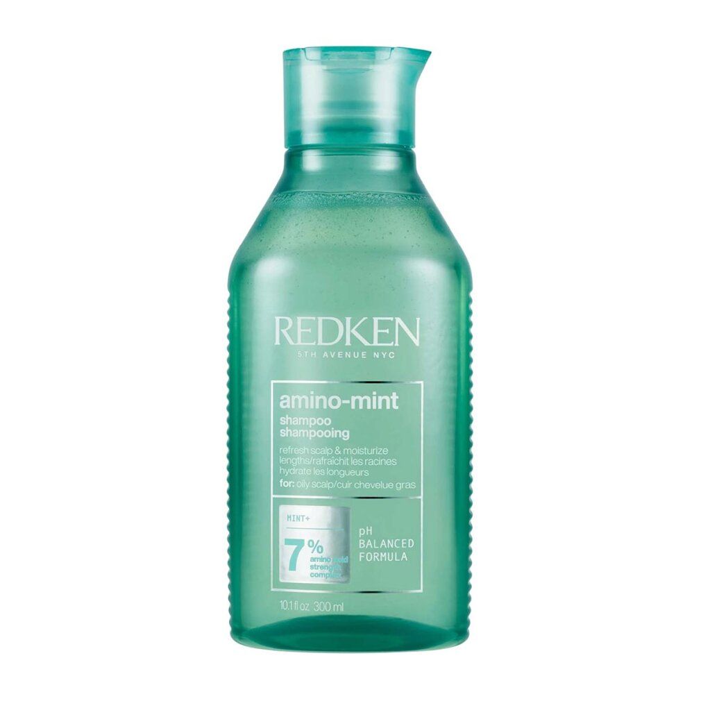 Flacone verde di shampoo Redken Amino Mint. Testo: Shampoo, formula pH bilanciata, 7%.