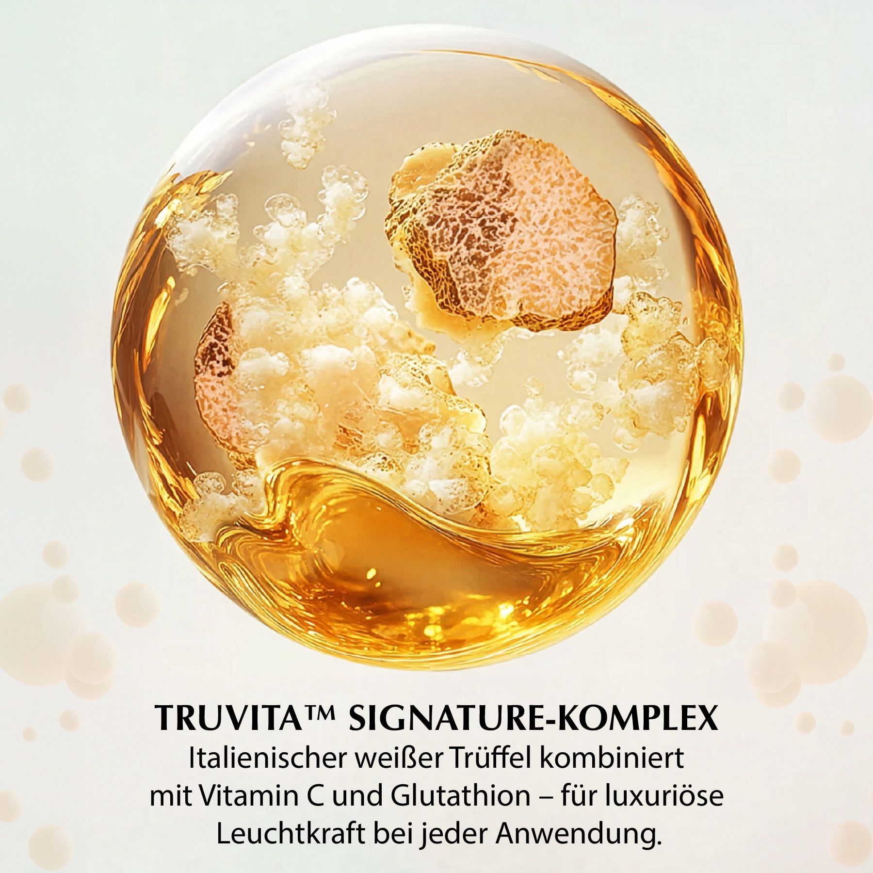 Una sfera con tartufo bianco. Testo: TRUVITA SIGNATURE-KOMPLEX. Tartufo bianco italiano combinato con vitamina C e glutatione.
