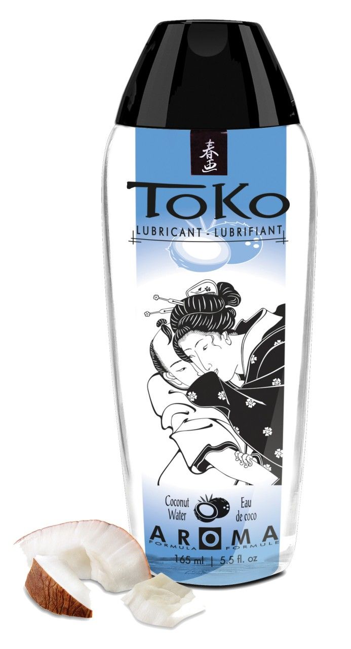 Lubrificante ToKo Aroma Acqua di Cocco in flacone trasparente con tappo nero. Pezzi di cocco accanto.