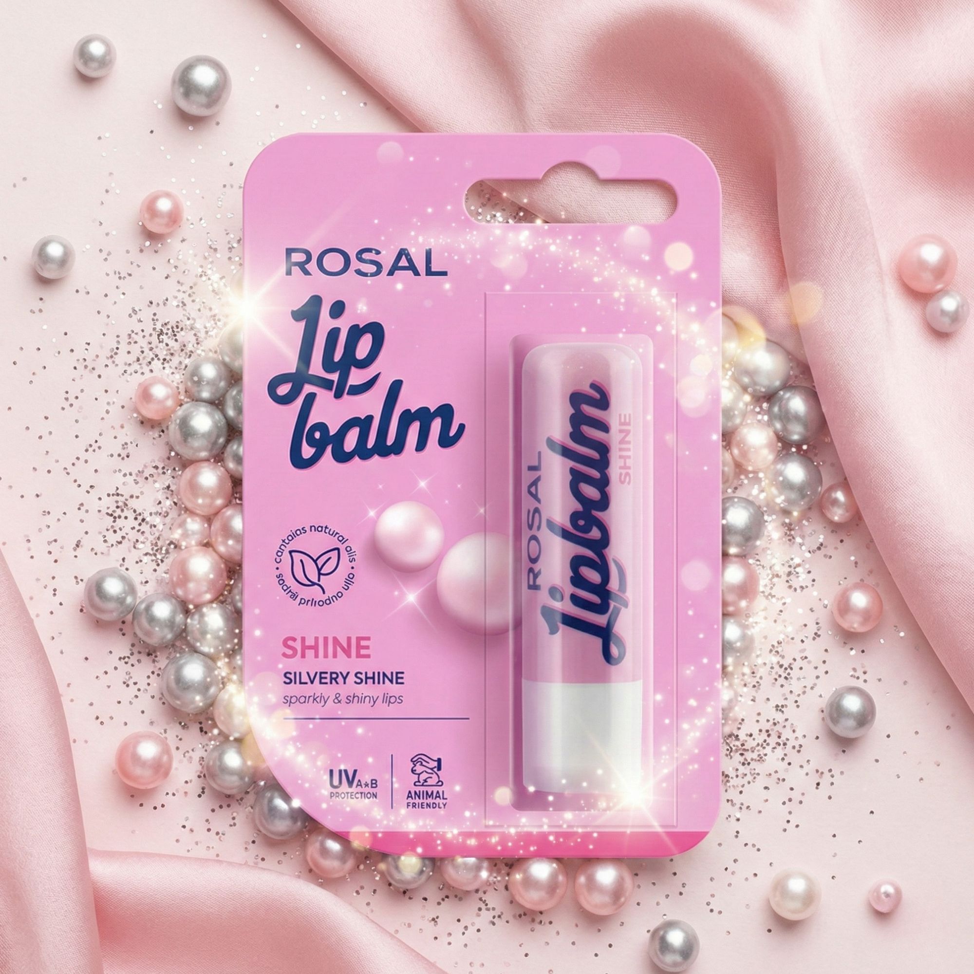 Confezione rosa con Lip Balm. Testo: ROSAL, Lip balm, Shine, Silvery Shine, protezione UV, cruelty-free. Glitter e perle.