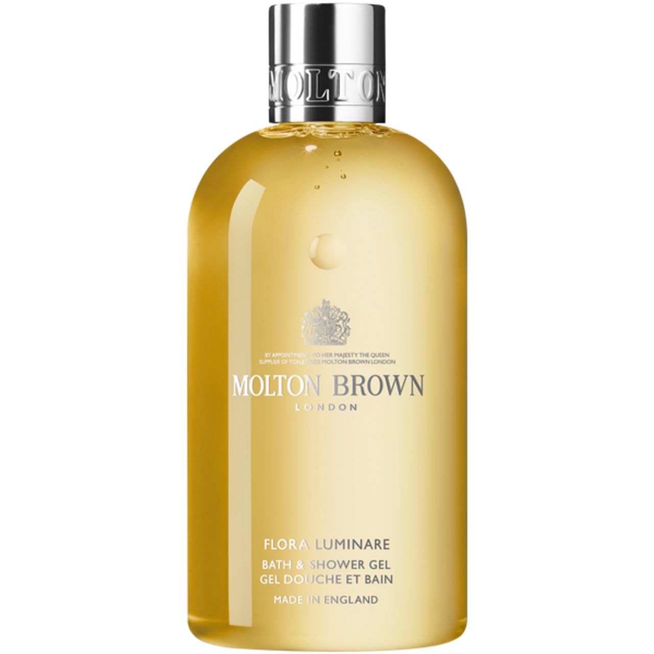 Flacone giallo con tappo argentato. Scritta: Molton Brown, Flora Luminare Bath & Shower Gel. Prodotto in Inghilterra. Con stemma.
