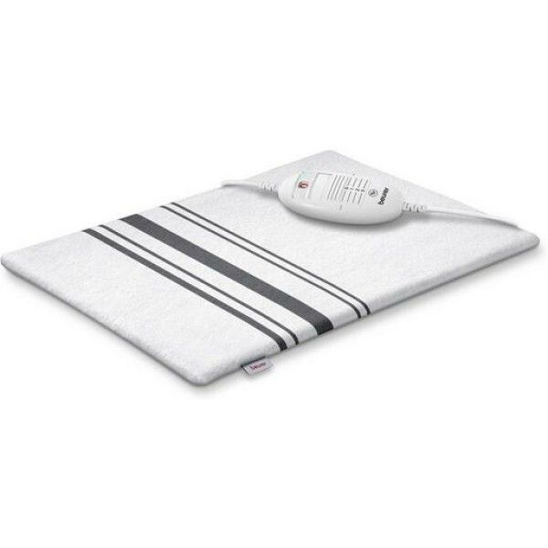 Cuscino riscaldante bianco con strisce nere e controllo. Il marchio Beurer è visibile. Il cuscino è su una superficie.