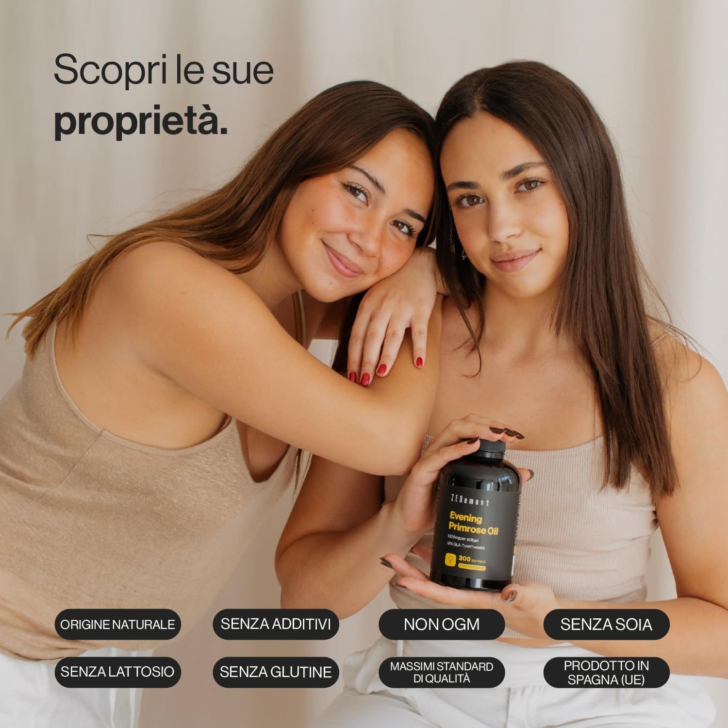 Due donne tengono in mano una bottiglia nera. La bottiglia riporta Zenement e Evening Primrose Oil. Scritte: Origine naturale, senza additivi, non OGM, senza soia.