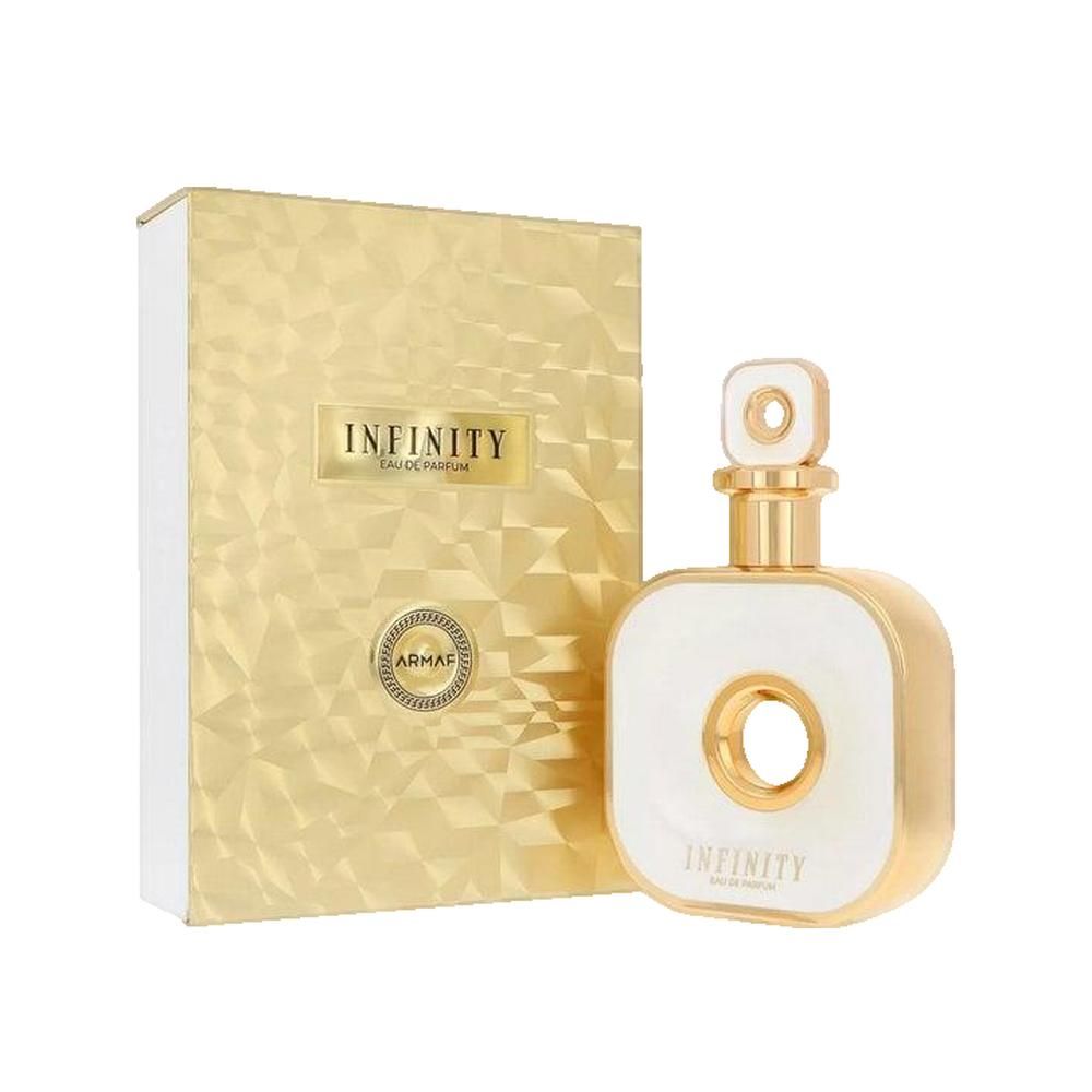 Flacone di profumo e confezione. Flacone quadrato bianco con dettagli dorati e foro centrale. Confezione dorata.