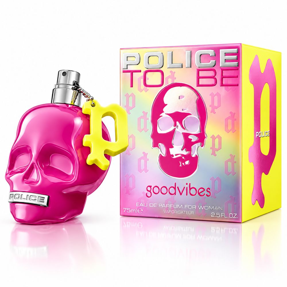 Flacone di profumo rosa a forma di teschio con ciondolo giallo e scatola coordinata.