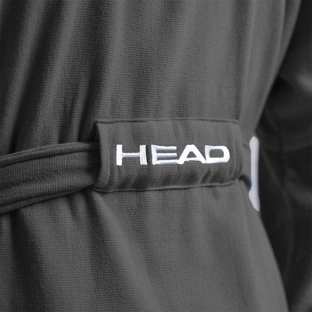 Cintura accappatoio grigia con scritta HEAD bianca. Primo piano. Tessuto tessile.