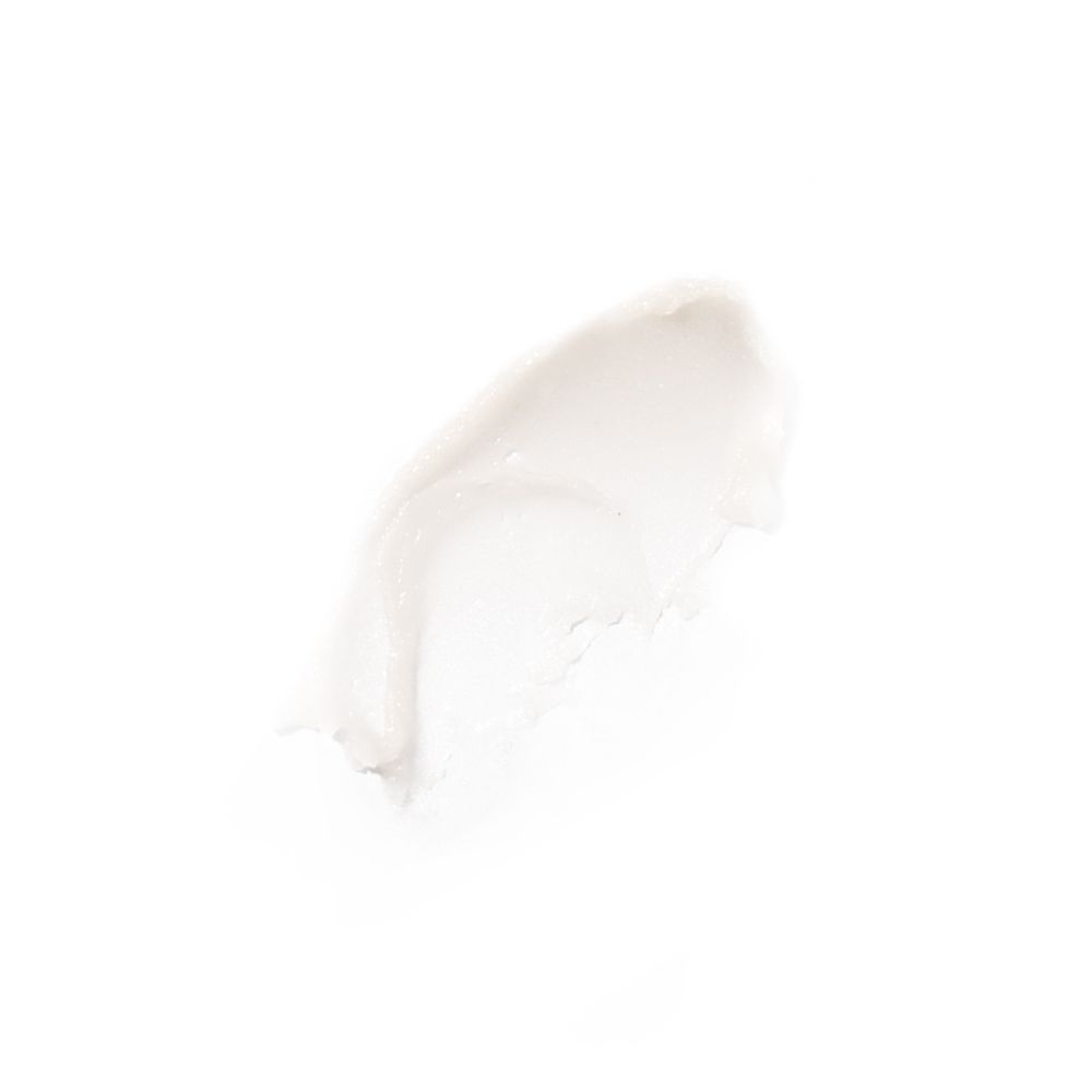 Macchia di crema bianca su sfondo bianco. Consistenza visibile.