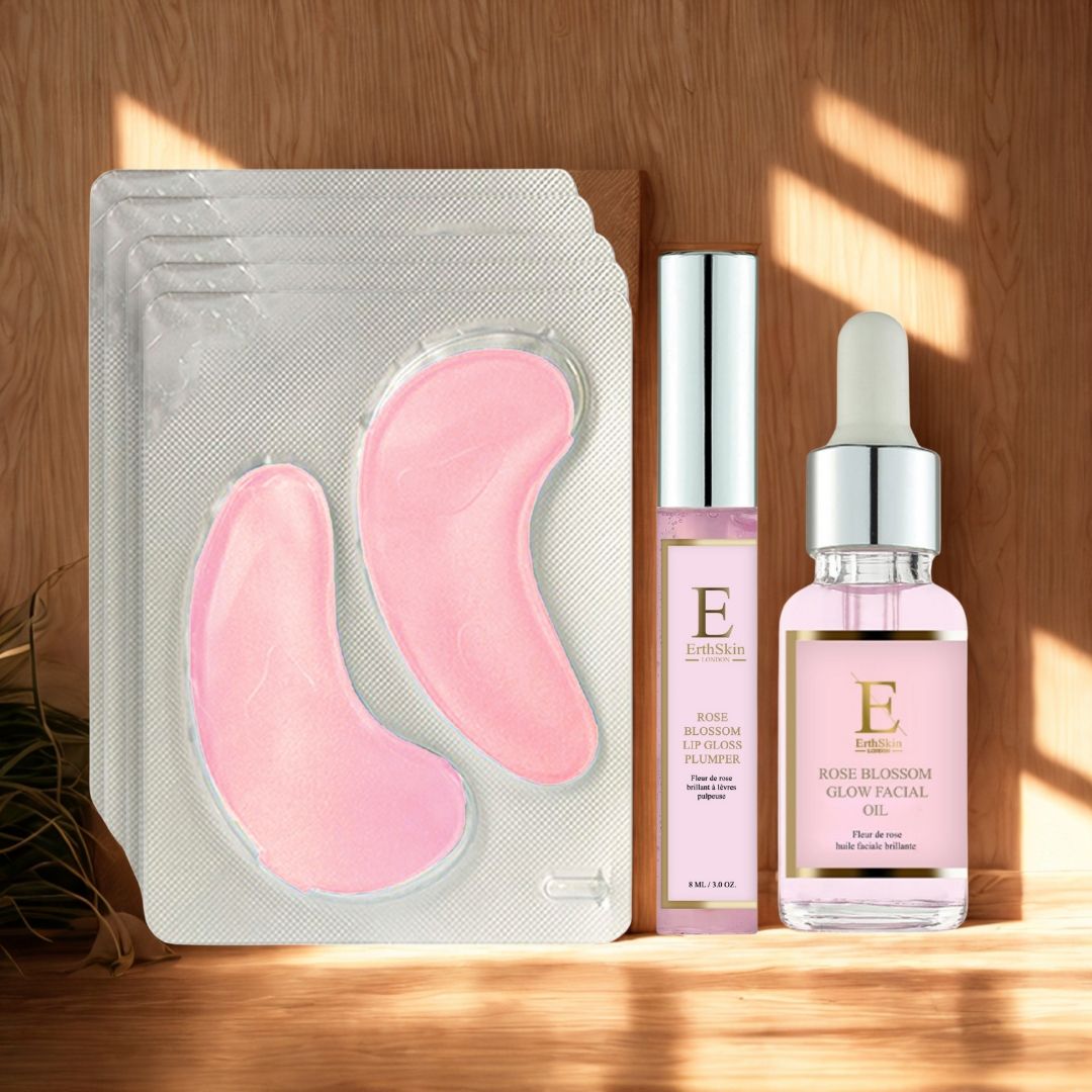 Patch occhi rosa, lucidalabbra e olio viso. Patch in blister. Lucidalabbra e olio con logo "E". Sfondo in legno.