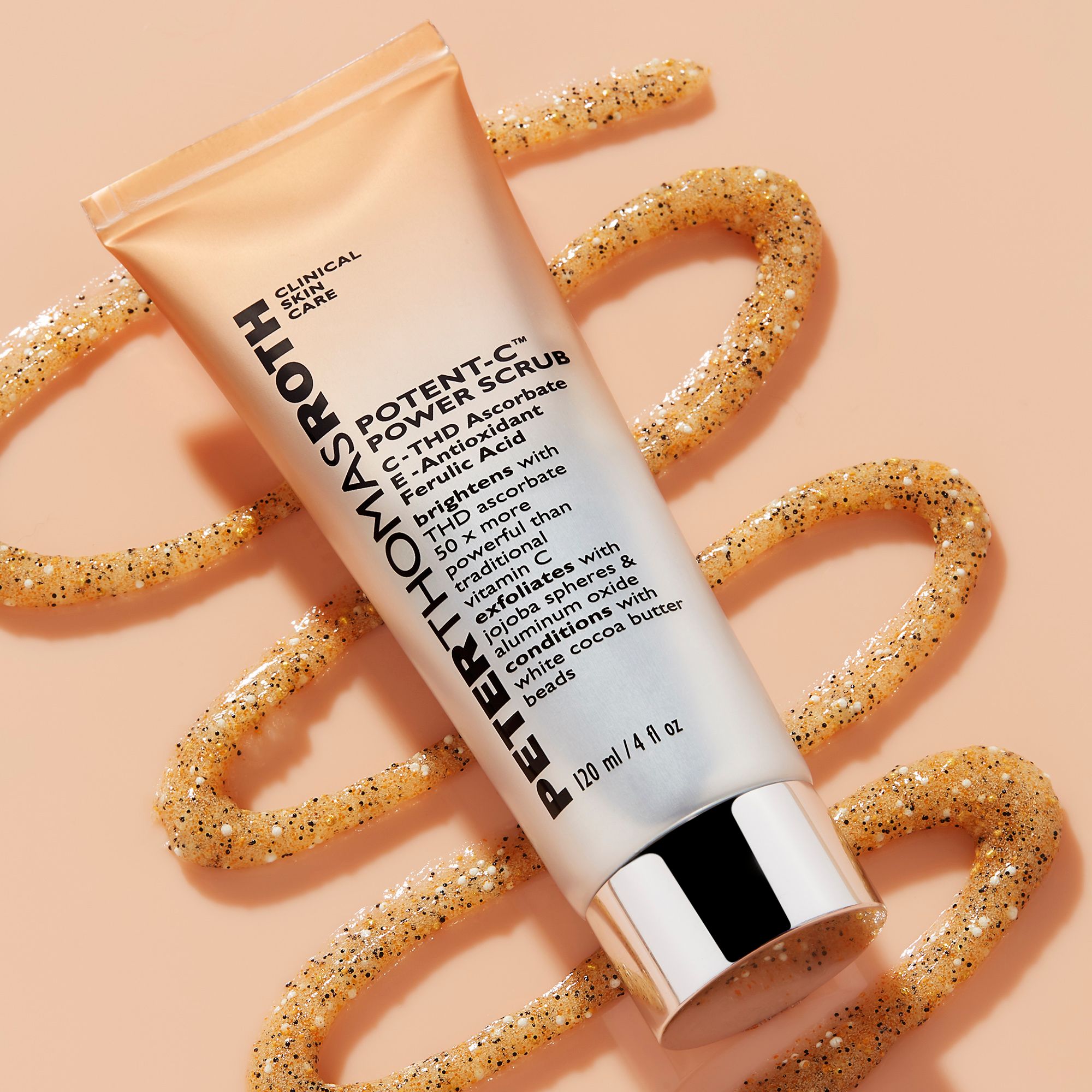 Tubo con prodotto e texture esfoliante. Scritta: Peter Thomas Roth, Potent-C Power Scrub. 120 ml/4 fl oz.