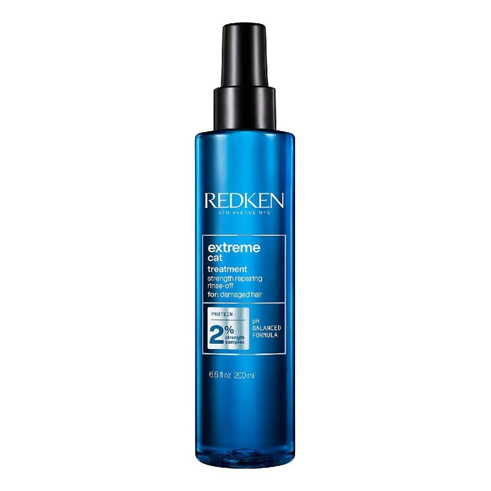 Flacone spray blu con erogatore nero. Scritte: Redken, extreme cat, treatment. Contiene 2% di proteine. Formula pH bilanciato.