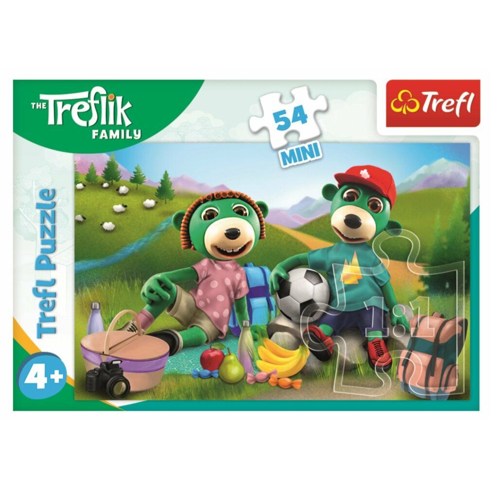 Puzzle Treflings: Auf einer Reise. 54 pezzi. Confezione con due personaggi verdi, pallone da calcio, cestino da picnic e zaino.