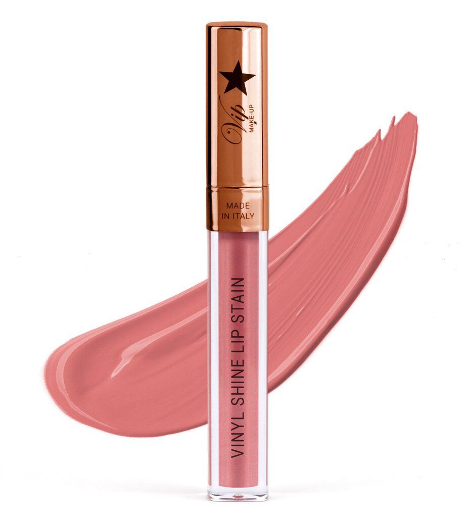 Un rossetto liquido color pesca con finitura lucida, applicato come un ampio tratto di pennello.