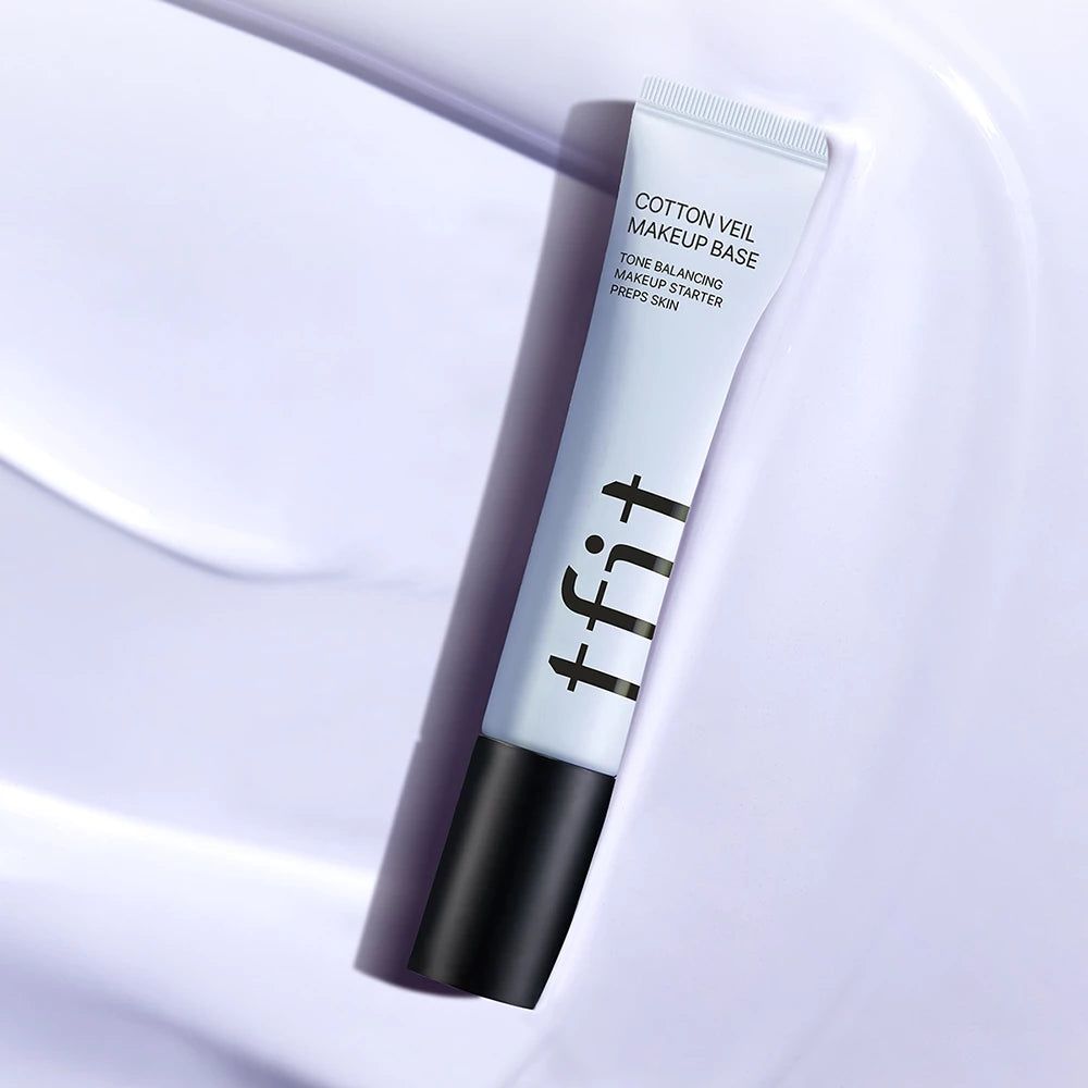Tubo di TFIT Cotton Veil Makeup Base, Viola Vivace, su sfondo viola.