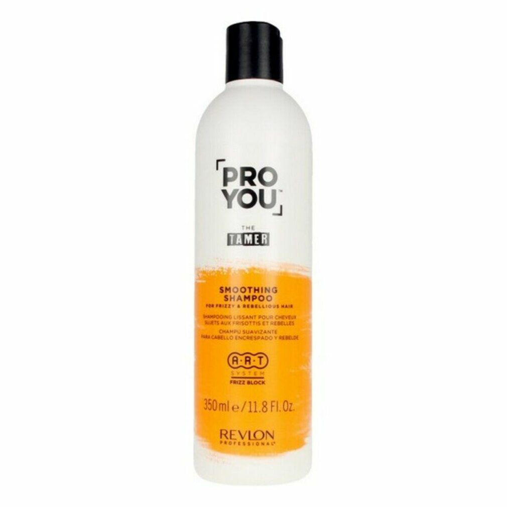 Flacone di shampoo bianco con tappo nero. Scritta: PRO YOU THE TAMER, Smoothing Shampoo. Striscia arancione. Revlon.