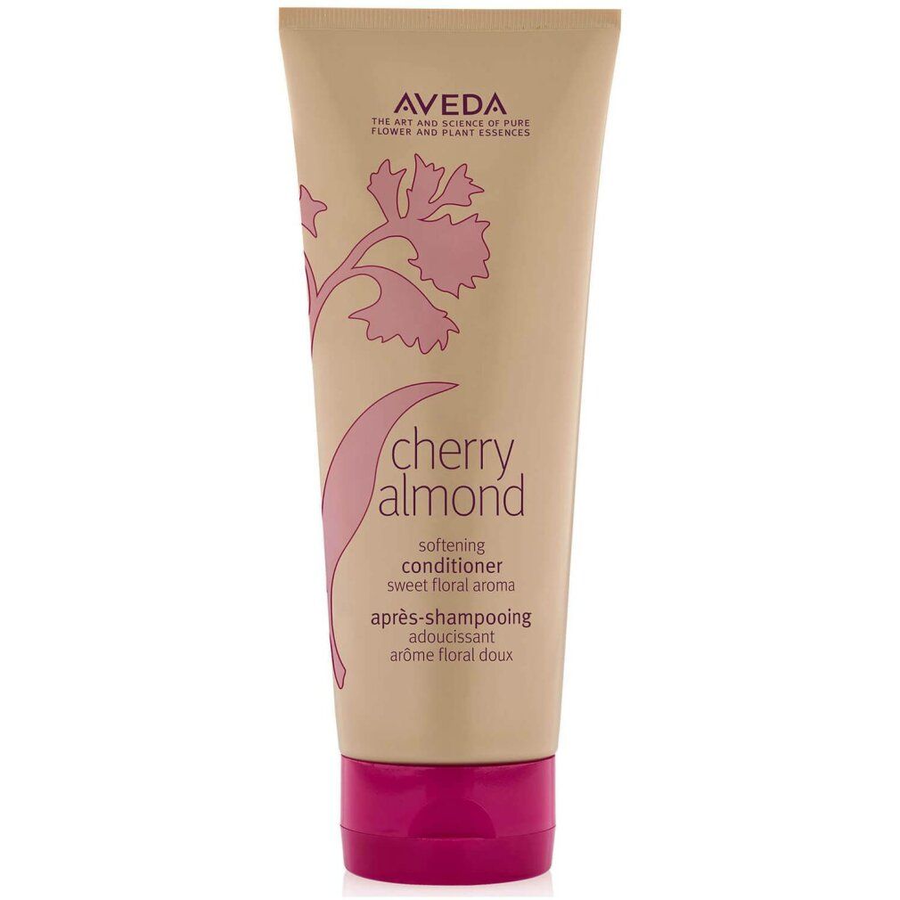 Tubo beige con tappo rosa. Scritta: Aveda, Cherry Almond, Softening Conditioner. Design floreale rosa.