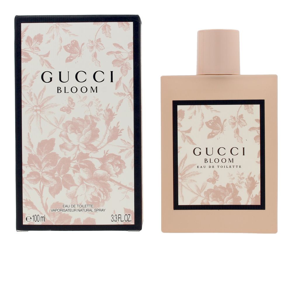 Flacone e scatola rosa. Scritta Gucci Bloom. Cornice nera con motivo floreale. Eau de Toilette.