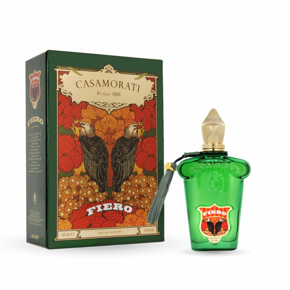 Flacone in vetro verde con tappo dorato e nappa. Accanto, una scatola verde con design floreale e scritta « Fiero ».