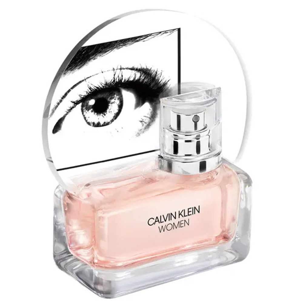 Flacone con liquido rosa, tappo argentato. Scritta: CALVIN KLEIN WOMEN. Sfondo: grafica occhio.