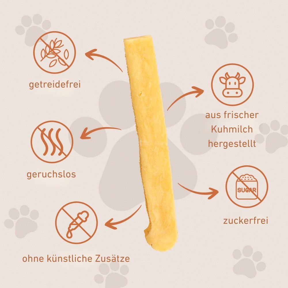 Uno snack masticabile giallastro con frecce che puntano a simboli: senza cereali, inodore, senza additivi artificiali, con latte vaccino fresco, senza zucchero.
