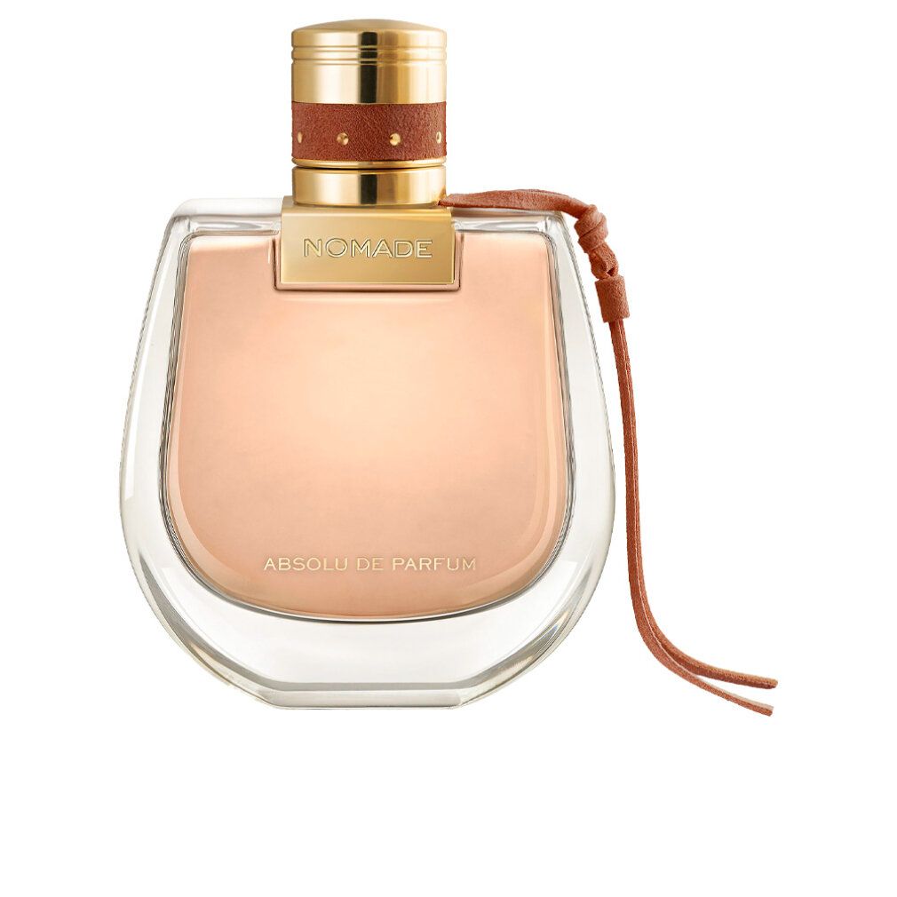 Flacone di profumo con tappo dorato, cinturino in pelle marrone. Scritta 'Nomade Absolu de Parfum'. Flacone trasparente.