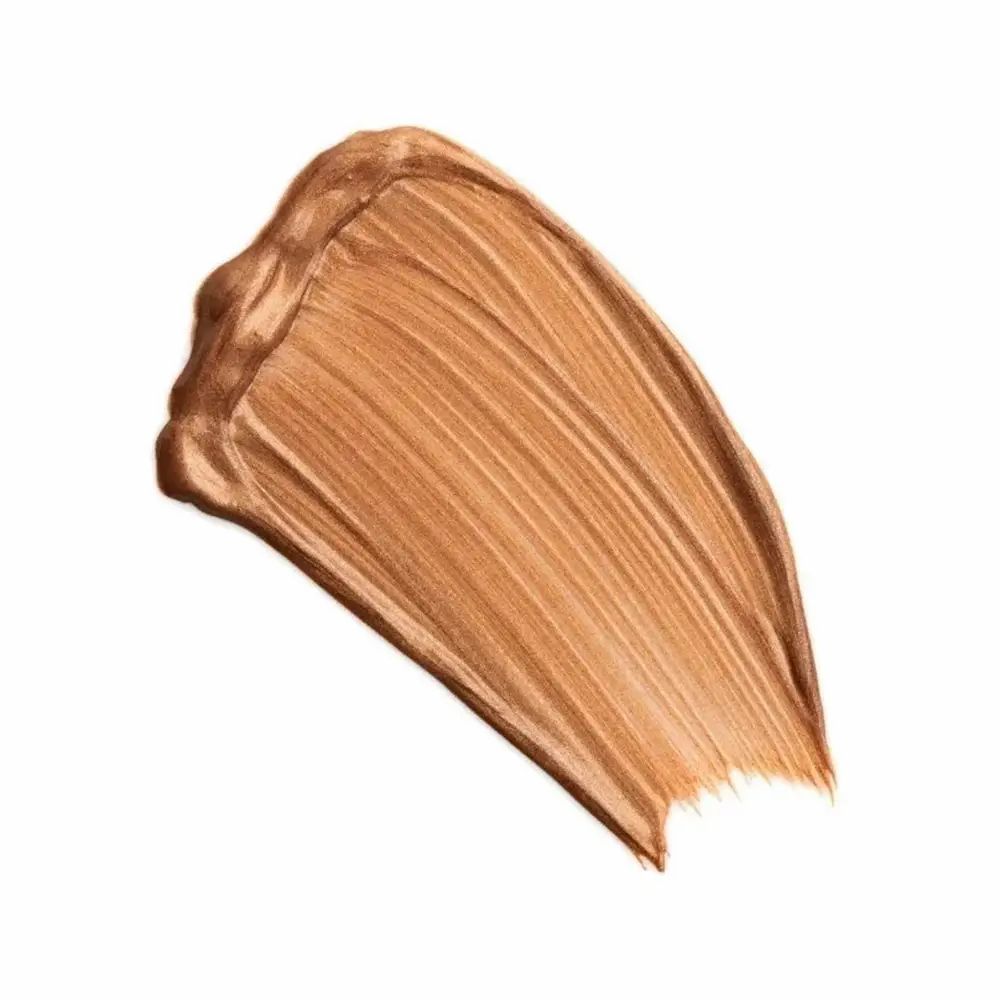 Macchia di colore bronzo su sfondo bianco. Texture con superficie lucida.