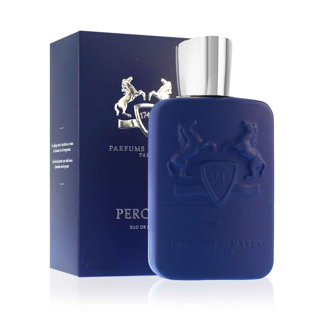 Flacone di profumo blu con tappo argentato e scatola blu. Logo in rilievo e testo sul flacone e sulla confezione.