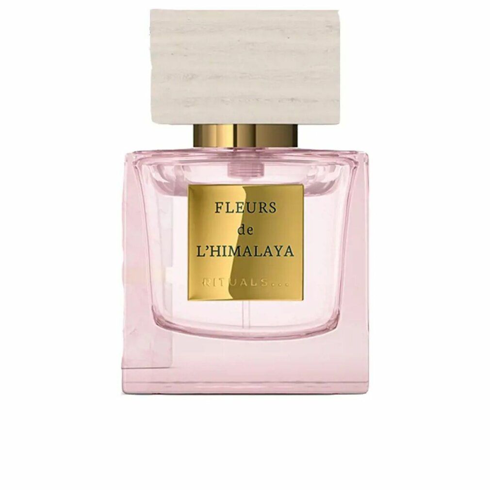 Flacone rosa con tappo in legno. Scritta: Fleurs de L'Himalaya. Testo dorato su etichetta rettangolare.