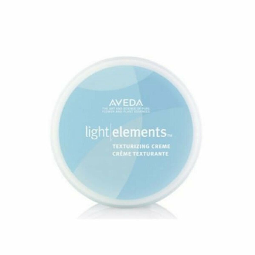 Contenitore rotondo blu con coperchio bianco. Scritta: Aveda light elements. Crema texturizzante. Crème texturisante.