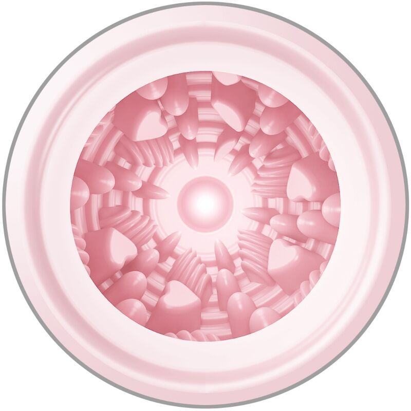 Primo piano dell'interno di un masturbatore rosa con texture complesse a forma di cuore e anello.
