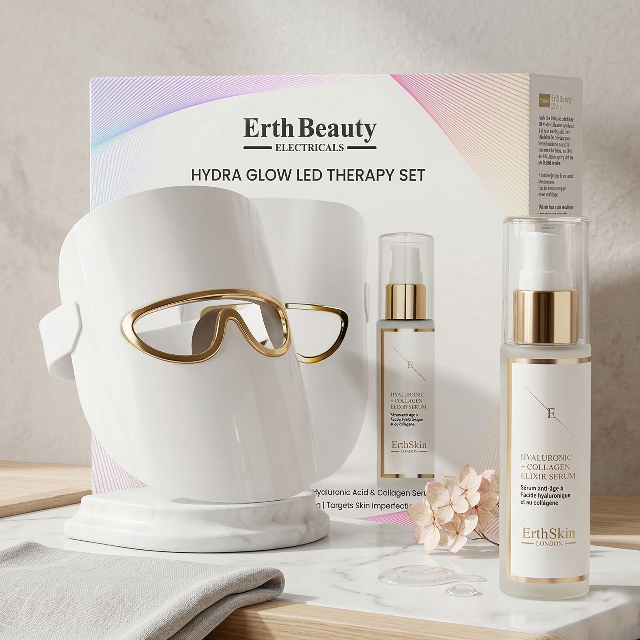 Set Erth Skin London Hydra Glow LED Therapy con maschera viso e due sieri, disposti su un tavolo.