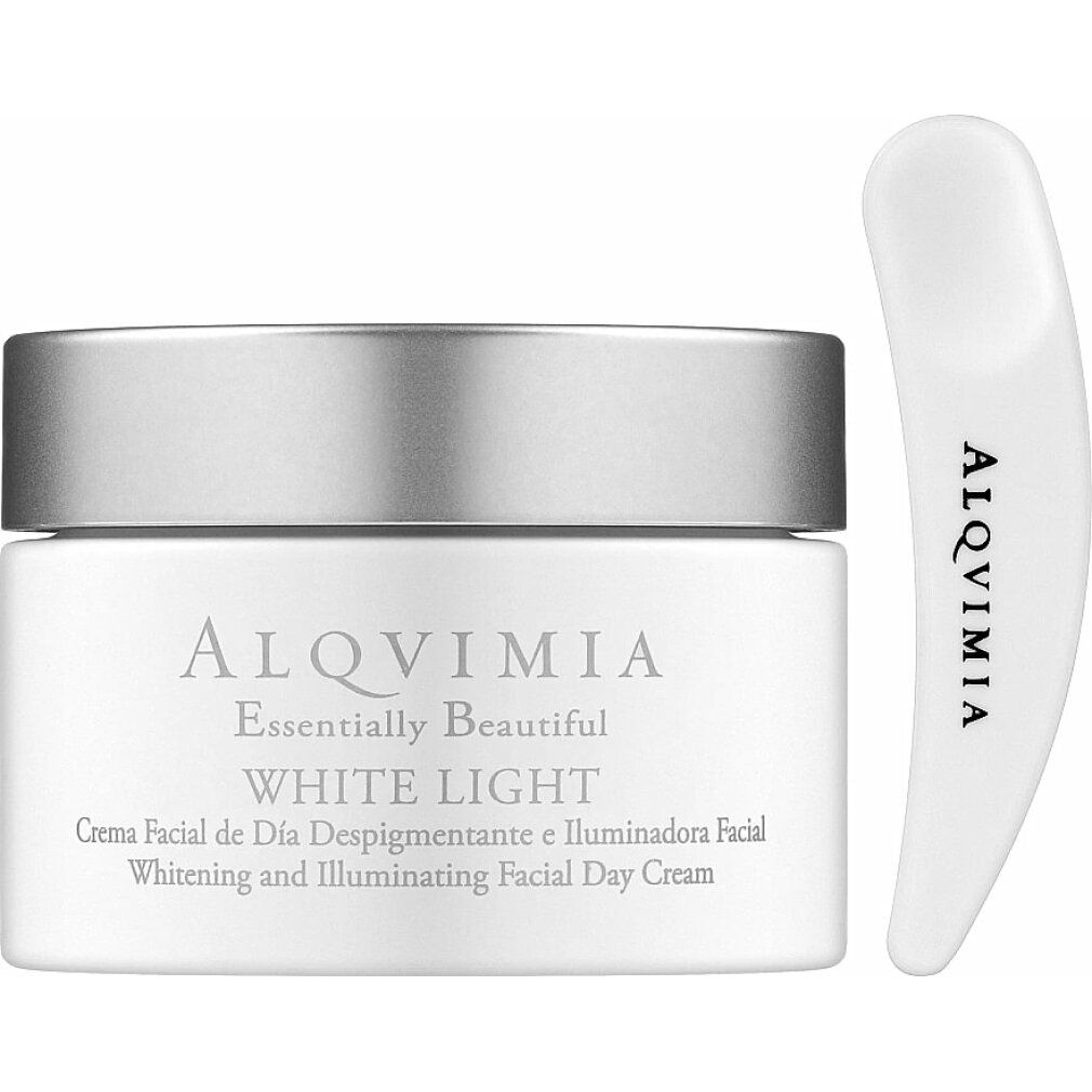 Vasetto di crema con coperchio argentato e spatola. Scritta: Alqvimia, White Light. Testo sottostante: Crema Facial de Día Despigmentante e Iluminadora Facial.