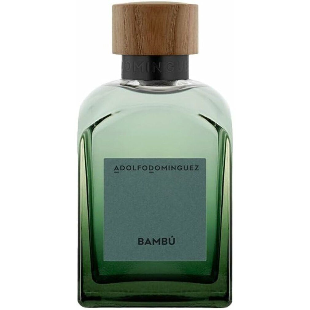 Flacone di vetro verde con tappo in legno. L'etichetta riporta la scritta "Bambú" e il nome del marchio "ADOLFO DOMINGUEZ".