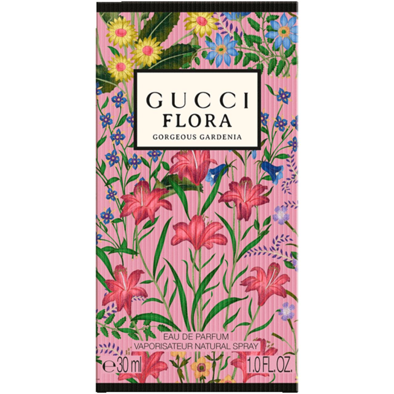 Scatola rosa Gucci Flora Gorgeous Gardenia. Motivo floreale. Testo: Gucci Flora Gorgeous Gardenia, Eau de Parfum, 30 ml, 1.0 FL.OZ.