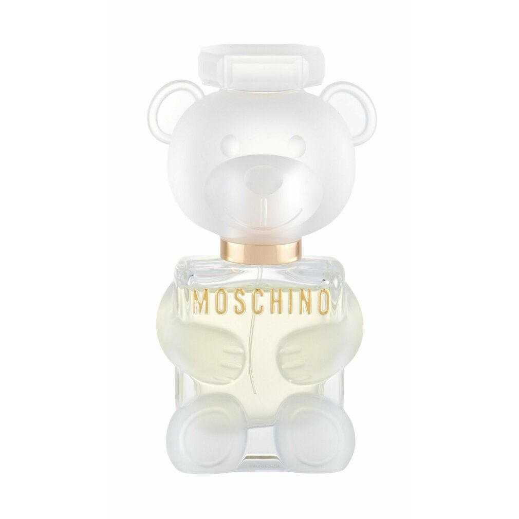 Flacone di profumo a forma di orsetto. Design trasparente con collare dorato. Scritta: MOSCHINO.