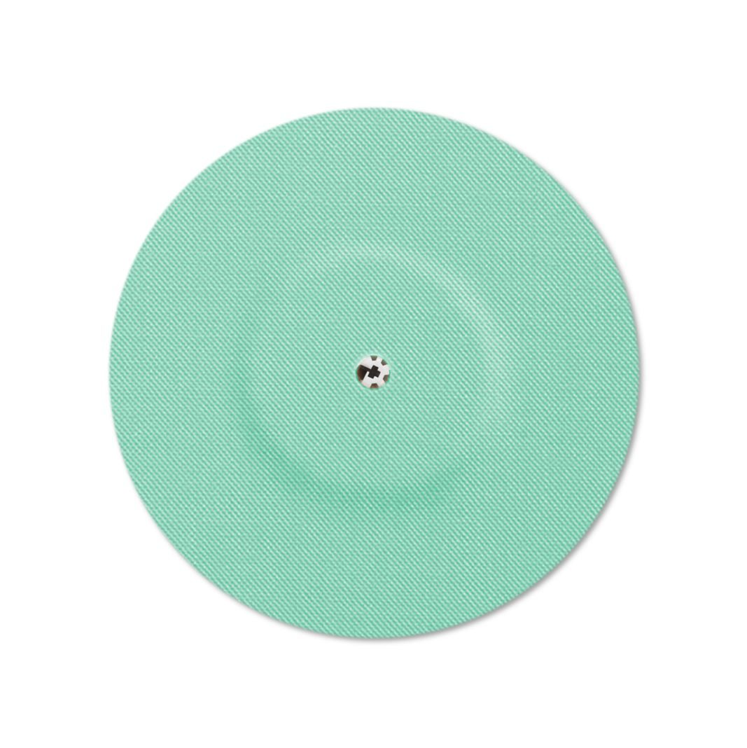 Cerotto rotondo menta con foro di ventilazione e superficie a coste. Foro centrale.
