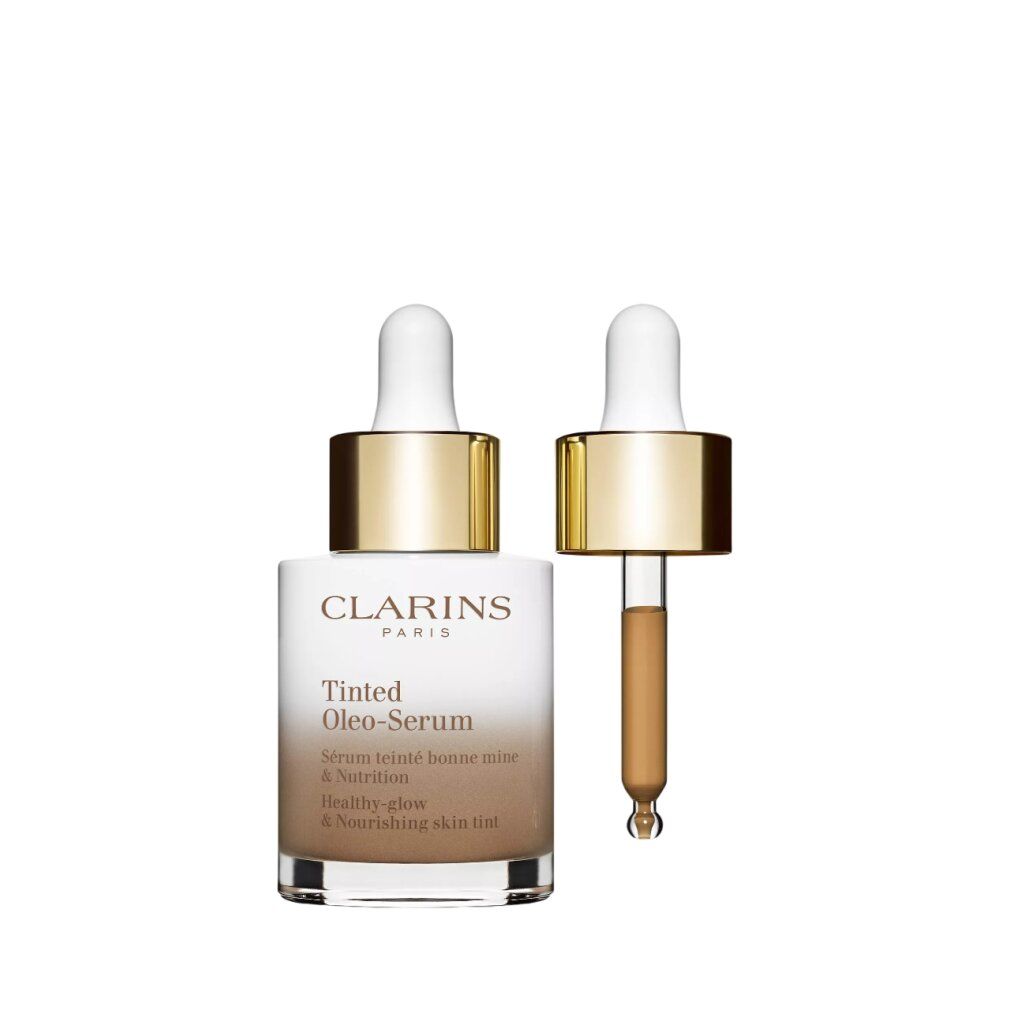 Flacone sfumato bianco-marrone, tappo dorato e pipetta. Pipetta accanto. Scritta: Clarins Paris, Tinted Oleo-Serum.