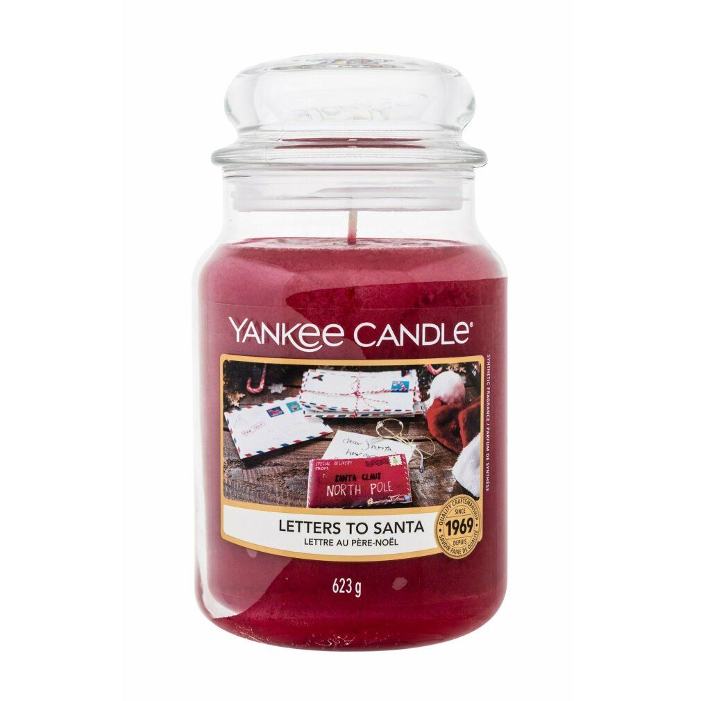 Candela profumata rossa in vaso con coperchio. Etichetta "Letters To Santa". Marchio Yankee Candle. 623g.