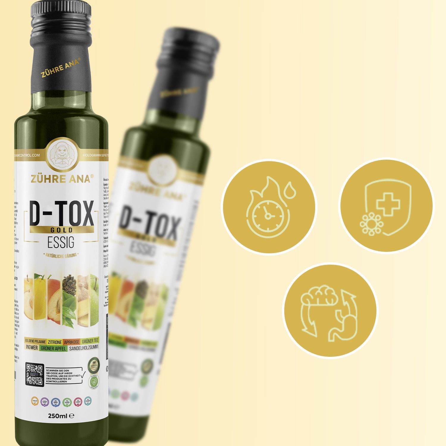 Due bottiglie verdi con tappo nero. Scritta: Zühre Ana D-Tox Gold Essig. Sfondo con icone: orologio, scudo, intestino.